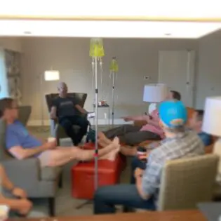 A group of people sitting around in a room.